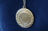 Mechanical engraving on a medal 
